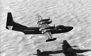 Warbird Picture - R3Y-1 Tradewind low over San Francisco Bay near NAS Alameda