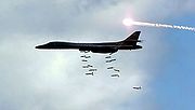 Airplane Pictures - B-1B releasing bombs and ejecting a MJU 23 decoy flare