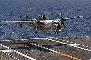 Airplane Pictures - A C-2A lands on the flight deck of USS Kitty Hawk (CV-63) in the western Pacific Ocean.