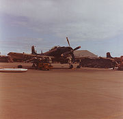 Warbird picture - A-1 Skyraider of the VNAF 520th Fighter Squadron being loaded with napalm at Danang AB in 1967.