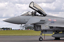 Airplane Picture - Close up view of an RAF Typhoon F2, showing the deflected canard control surface immediately below the pilot