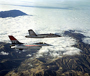 Airplane Pictures - An air-to-air right side view of a YF-16 aircraft and a Northrop YF-17 aircraft, side-by-side, armed with AIM-9 Sidewinder missiles