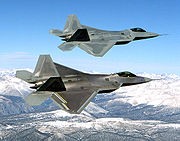 Airplane Pictures - Two F-22s during flight testing, the upper one being the first EMD F-22, Raptor 01