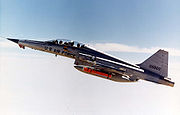 Airplane picture - USAF F-5F with AIM-9J Sidewinder, AGM-65 Maverick missiles and auxiliary fuel tanks over Edwards Air Force Base, in September 1976.