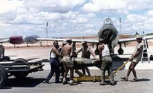 A Portuguese F-84 being loaded with ordnance in the 1960s, at Luanda Air Base, during the Portuguese Colonial War.