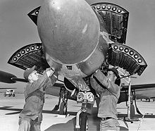 Airplane Picture - F-94C being armed with 2.75 in (70 mm) FFARs