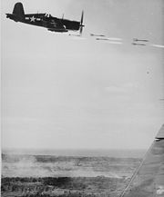Airplane Pictures - A Corsair fires its rockets at a Japanese stronghold on Okinawa