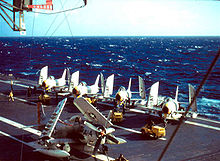 4 FJ-3 Fury fighter-bombers of VF-33 and an AD-6 of VA-25 on the deck of the USS Intrepid in the North Atlantic in 1957