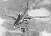 Warbird picture - A swept-wing F9F-6 Cougar (foreground) and a straight-wing F9F-5 Panther in flight