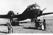 Warbird picture - A He 177 during refueling and engine-run up, 1943. Note the four-bladed propeller. The He 177 is painted in a night camouflage scheme.