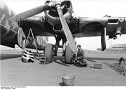 Warbird picture - The undercarriage well covers/hatches have been deployed showing the inner casing. To the extreme right is a external rack which could carry conventional bombs, Fritz X or Henschel Hs 293 precision-guided warheads under the wing.