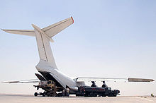 Airplane Picture - A commercial variant of Ilyushin Il-76 loading cargo at Ali Base in Iraq
