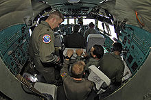 Airplane Picture - USAF and IAF airmen work inside the cockpit of an Indian Il-76.