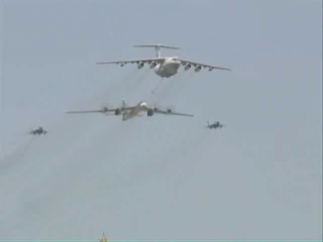 Airplane Picture - A Tu-95 performs a fly-over with an Il-78 and two MiG 29s simulating aerial refueling at the Victory Day Parade in Moscow on 9 May 2008.