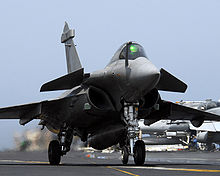 Airplane Picture - A French Navy Rafale M performing a touch and go on the deck of the carrier USS John C. Stennis (CVN-74).