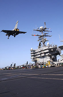 Airplane Picture - A Rafale M flies above the aircraft carrier USS John C. Stennis.