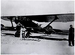 Airplane Picture - Sabiha Gxkxen holding a bomb before the bombardment mission over Dersim with her Breguet 19.