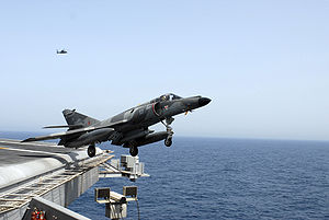 Warbird Picture - A Super Etendard performs a touch-and-go landing on the flight deck of the USS John C. Stennis (CVN-74).