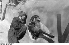 Airplane Picture - The rear defence barbettes of a Me 210 being maintained