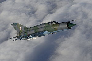 Warbird Picture - Croatian Air Force MiG-21bis D soaring above the clouds.