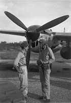 Airplane Pictures - (L-R) Thomas B. McGuire and Charles Lindbergh discussing a mission on Bial Island in July 1944