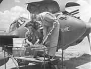 Airplane Pictures - Pilot and aircraft armorer inspect ammunition for the central 20 mm cannon