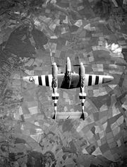 Airplane Pictures - P-38 participating in the Normandy campaign as evidenced by the D-Day invasion stripes