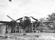 Airplane Pictures - Ground crew members of the 459th Fighter Squadron, nicknamed the Twin Dragon Squadron', working on a Lockheed P-38 at an air base in Chittagong, India - January 1945