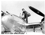 Airplane Pictures - Ruth Dailey, WASP climbs into a P-38