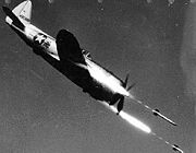 Airplane Pictures - Republic P-47D-40-RE in flight firing rockets (S/N 44-90386