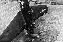 Warbird Picture - An SB2C Helldiver failed to catch the wire on landing and hit the first barrier, nose-diving into the deck (USS Hornet, 3 July 1944).