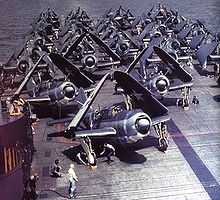 Warbird Picture - SB2Cs in tricolor scheme (front) on the flight deck of USS Yorktown in 1943.