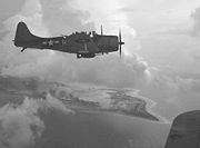 Airplane Pictures - A SBD from the USS Yorktown CV-10, over Wake Island piloted by Lieut Ridge Radney of bombing squadron VB-5, 5 October or 6 October, 1943 Photographed by LT Charles Kerlee of the Naval Aviation Photographic Unit commanded by LCDR Edward Steichen