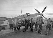 Airplane Pictures - Pilots of 611 West Lancashire Squadron lend a hand pushing an early Spitfire Mark IXb, Biggin Hill, late 1942