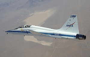 Airplane picture - NASA Dryden's T-38 trainer aircraft in flight over Cuddeback Dry Lake in Southern California