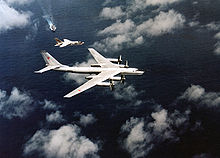 Airplane Picture - An F-8 of USS Oriskany intercepts a Tu-95 'Bear-B'.