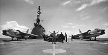 Airplane Picture - Two Crusaders prepare to launch from USS Midway; their variable-incidence wings are in the 