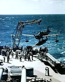 Warbird Picture - USS Missouri recovers a Vought OS2U Kingfisher during her 1944 shakedown cruise. Note the catapult below the plane, which was used to launch the planes off the battleship.