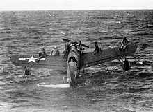 Warbird Picture - Downed American airmen near Truk await rescue on the wings of an OS2U Kingfisher